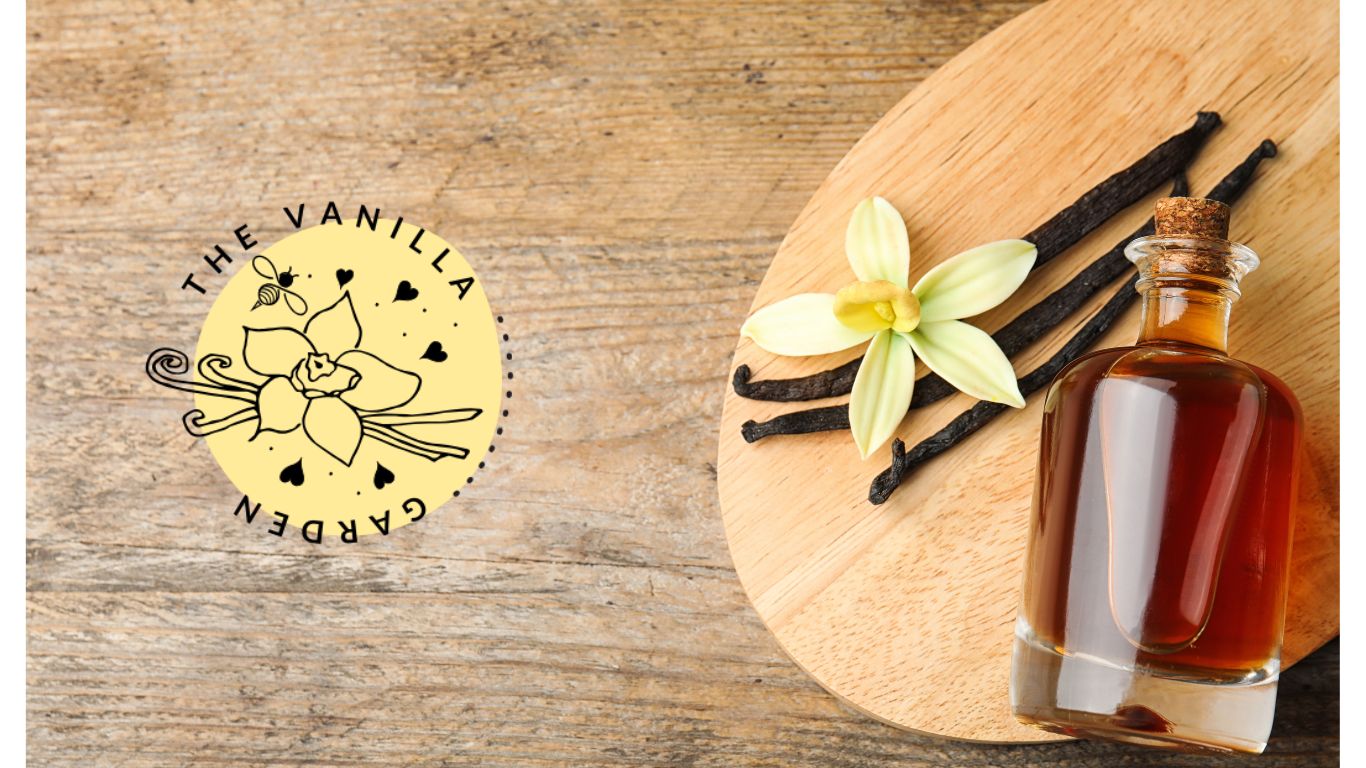 The Vanilla Garden logo next to jar of vanilla extract on a board next to vanilla beans and vanilla orchid flower